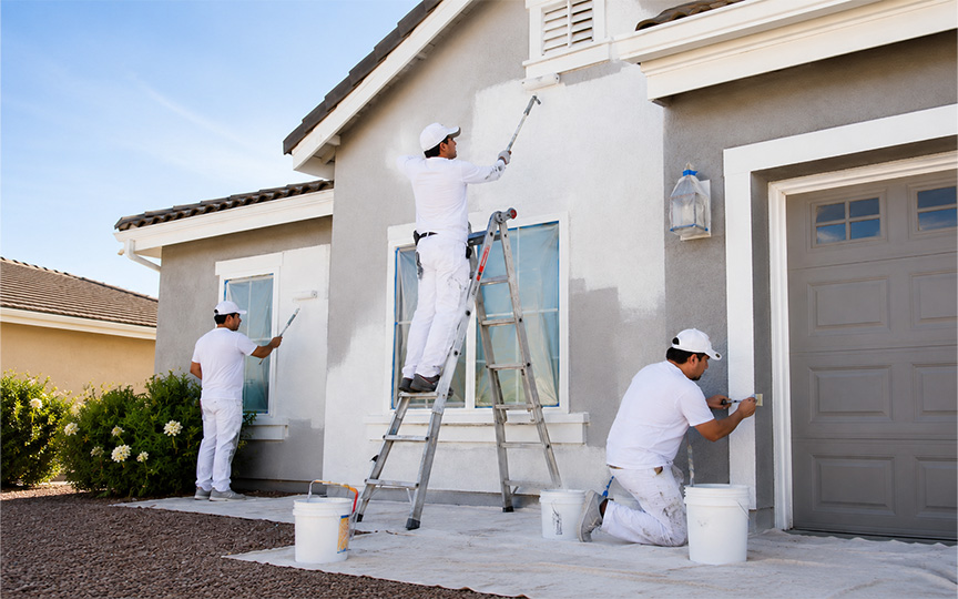 Painting crew working on a residential exterior.